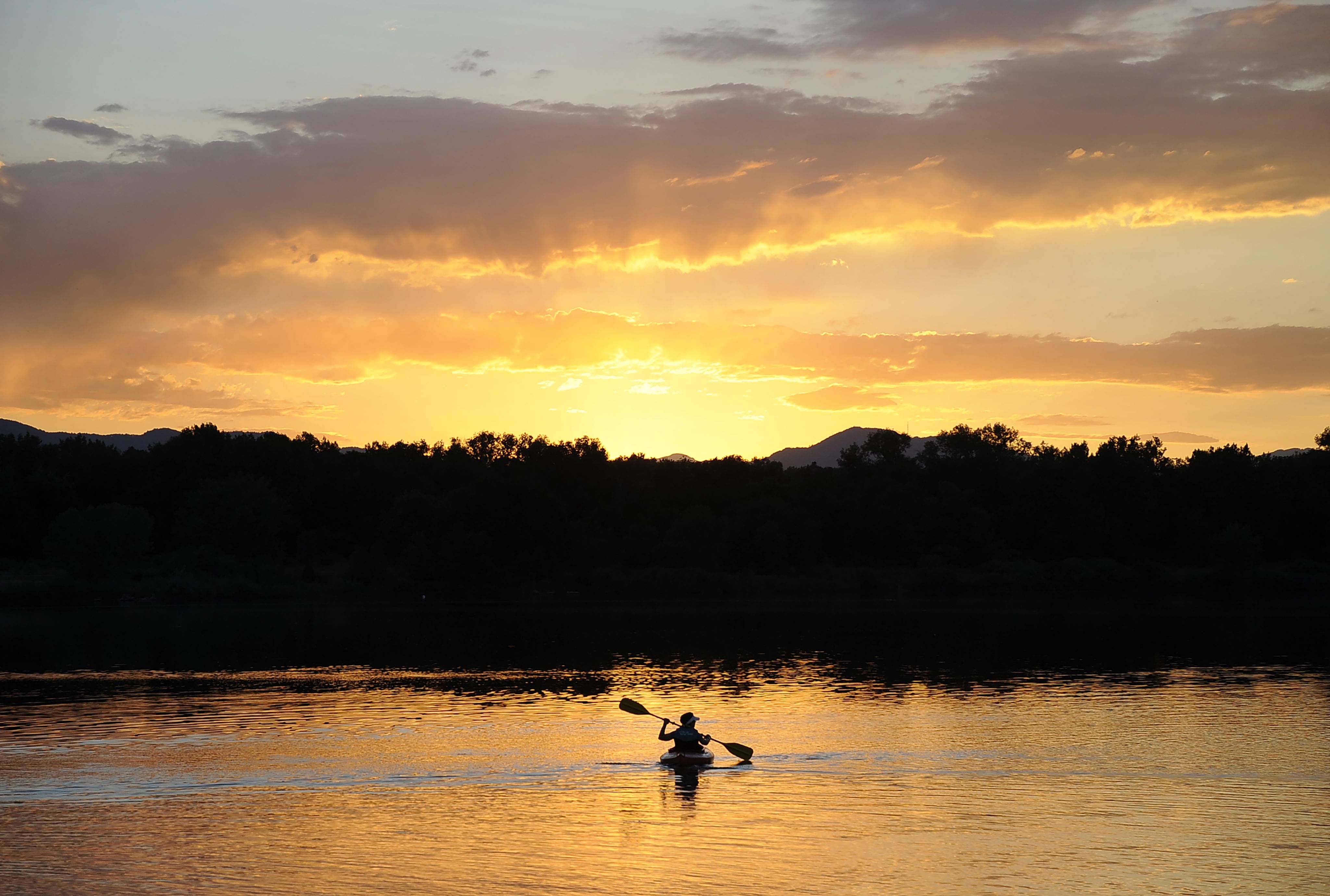 image of a kayaker at sunset