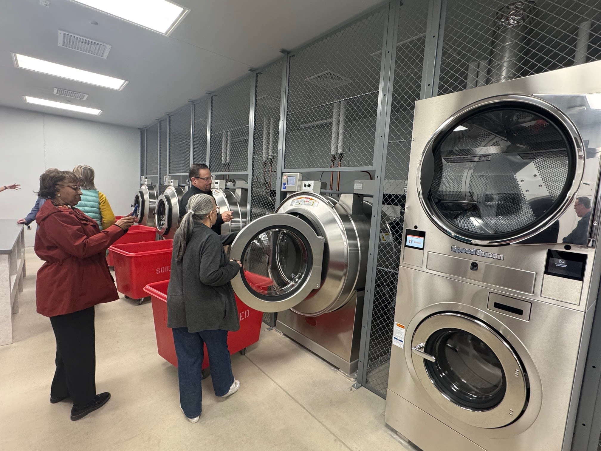 image of County commissioners touring the new laundry services at the detention center